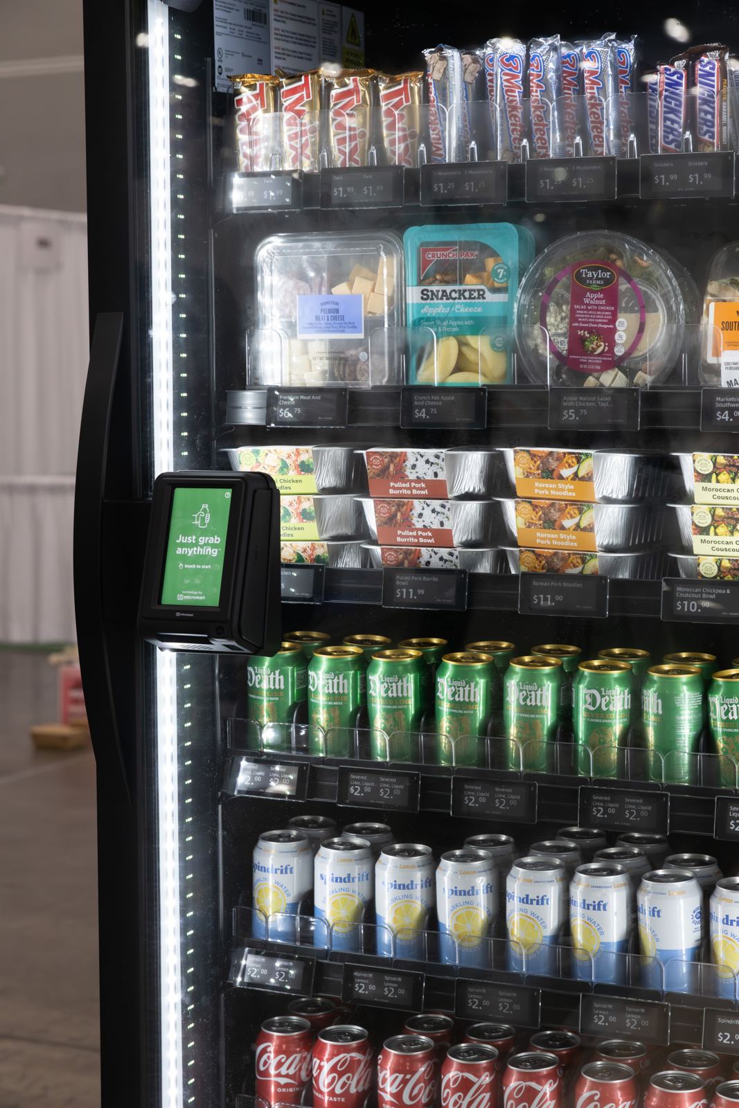 Stocked smart store shelves with fresh meals and drinks